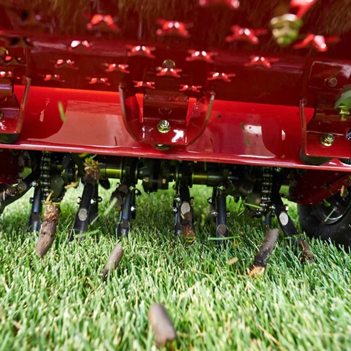 Lawn aeration machine in action